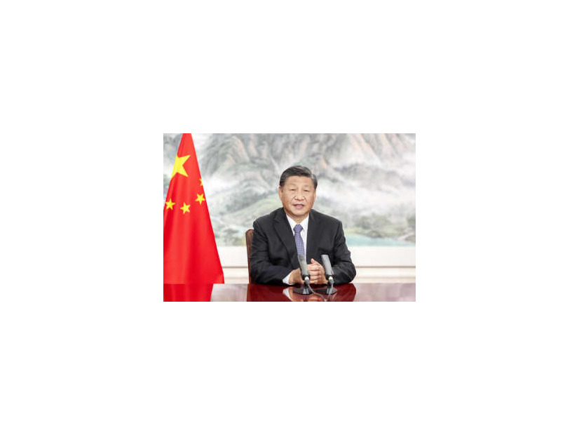 4日に開かれた「中国国際輸入博覧会」の式典でビデオ演説する中国の習近平国家主席（新華社＝共同）