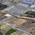半導体メーカーTSMCの子会社の工場建設予定地（手前）＝4月、熊本県菊陽町（共同通信社ヘリから）