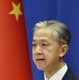 中国報道官、参列で「友好維持」