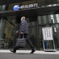 新生銀行の臨時株主総会の会場を示す看板＝8日午前、東京都中央区
